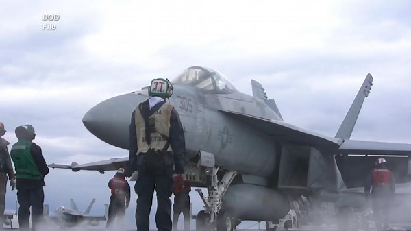 Fighter jet falls off aircraft carrier into the ocean
