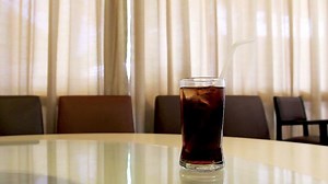 Download Cola in glass with motion background for free