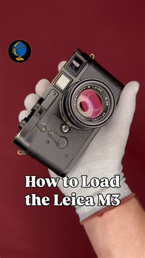 Blue Moon Camera and Machine on Instagram: "Here’s how to load one of greatest cameras ever. Have you ever shot with the Leica M3? To load this Leica M3 with film, we’ll remove the baseplate and flip down the film door. Next, we pull out the take-up spool and insert the film tip until it illuminates this arrow, pull out a little more film as shown in the diagram, and drop it in the camera. Making sure our film is tracking straight, we replace the baseplate, twist to lock it, and wind the advance