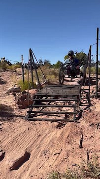 Handcycle on Moab Trail Cattle Guard.