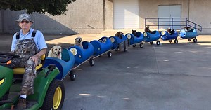 80-Year-Old Man Builds A Dog Train To Take Rescued Stray Dogs On Adventures