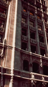 A very tall building with a clock on it's side