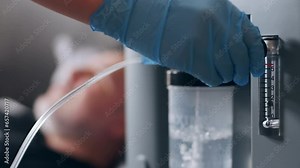 Working oxygen humidifier for nasal cannula, closeup oxygen generator, low oxygen saturation, bubbling water filter. Personal O2 generator for home usage. Oxygen concentrator Stock Video