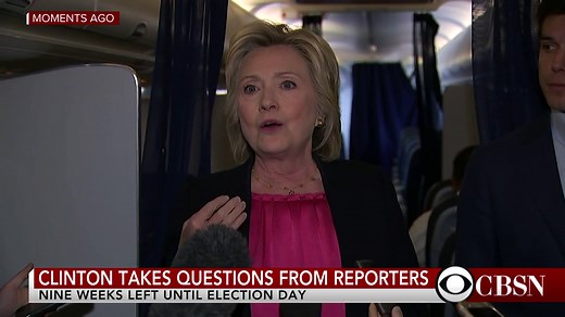 Hillary Clinton talks to reporters aboard new plane