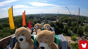 Why are these giant teddy bears riding a roller coaster?