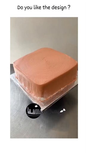 universal mems on Instagram: "The post shares a 66-second video of decorating a pink square cake using cocoa powder stencils for geometric patterns, chocolate drips, yellow buttercream sunflowers, and berry toppers, credited to Lulu Fashion Cakes, which has amassed 1.6 million views since its upload on 2025. Engagement reveals a polarising response, with 2,777 likes contrasting sharply against numerous replies dismissing the design as unappealing or "not pretty," underscoring debates on elaborat