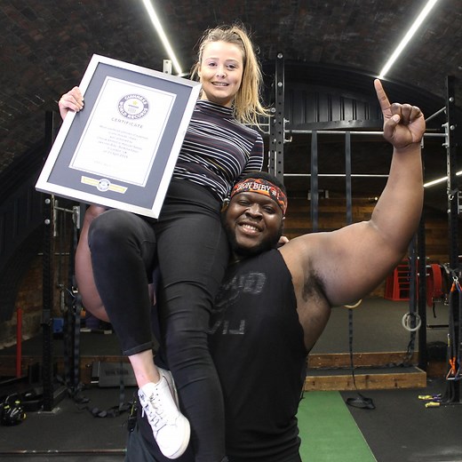 2.1M views · 1.6K reactions | The mighty IRON Biby from Burkina Faso, West Africa specialises in overhead log lifting at strongest man events. Lifting a person adds an extra element to the challenge! ‍♂️ | Guinness World Records | Facebook