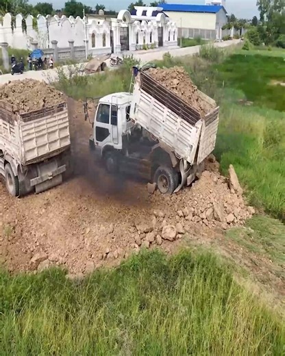 1.2K views · 22 reactions | Showing Action!!! Bulldozer Operator Work Skills: Pushing Soil into Lowlands and Dump Trucks Take Turns Unloading Soil | Bulldozer Operator | Facebook