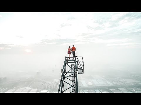Couple climb the highest construction site in the world
