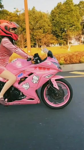 Riding a Pink Motorcycle with Style and Flair