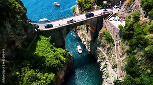 Aerial drone view of Fjord of Furore. The azure waters, cliffs and famous bridge in Amalfi coast, Italy
