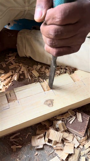 Hand-cut wood joinery using a chisel – traditional woodworking craftsmanship in action.”