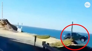 Dramatic dashcam shows car driving off highway cliff