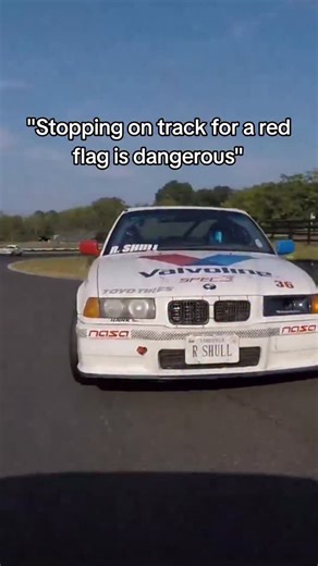 Fun Fact: most North American racing sanctioning bodies use a red flag for track stoppage and black flag for "return to the pits" with the exception of motorcycles (for obvious reasons). Stopping all movement on track allows for faster EV response to serious incidents like fires and rollovers where seconds matter. This allows EV to drive counter-race if needed or cut across grass without worrying about cars on track. It's not common for incidents to happen from red flags and no, the drivers don'