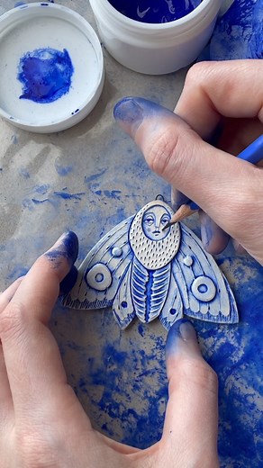 Art By Hana Rubi on Instagram: "Busy painting moth folk.. Some people are surprised to hear that I use a ‘cold finish’ technique rather than a glazed finish.. I just personally prefer this technique, I like to paint on fired bisque, seal it with a matte varnish and then it doesn’t need firing again! I’m also doing these in larger sizes! I’ll let you know when I’ve picked a time and date for my next ceramic shop update, but I’m planning for the end of the month.. . . . . . #ceramics #ceramicart #
