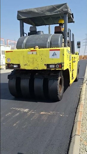 A rubber tire roller provides a kneading action to achieve the compaction necessary on asphalt