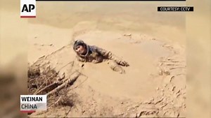Woman Rescued From Mud in China!