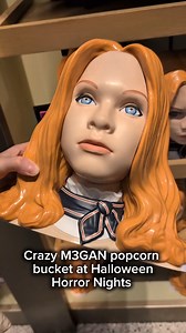 Check out this super cool M3GAN popcorn bucket we spotted at Universal Studios' Halloween Horror Nights, just don't take her mask off... | Total Film