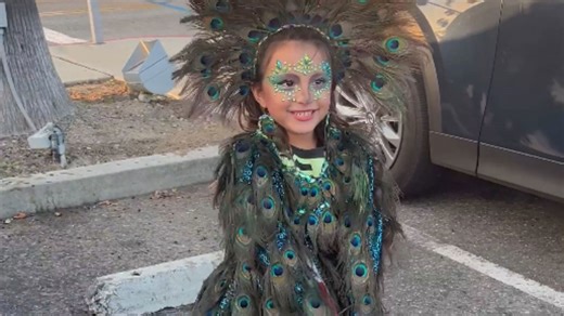 Handmade peacock queen costume makes a little girl the main character of Halloween