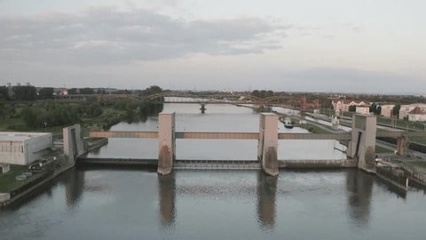 clip-3995504481-large-canal-lock-boat-navigating-through-surrounded