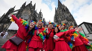 Carnival's women revelers take over the Rhineland for a day, dancing, drinking and kissing