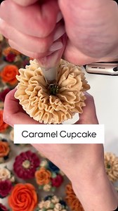 A fun, frilly and delicious Caramel cupcake! This was just one of 100 cupcakes! Yes I had a very sore hand after all that piping but I loved every second 🥰🌸💖 . #cake #cupcakes #flowers #floralcupcakes #flowercupcakes #buttercreamflowers #piping #baking #autumncupcakes #autumnflowers #caramel #wedding #weddingcupcakes #floralcupcakes #edibleflowers #cupcakedecorating #fyp #petalsbakehouse | Petals Bakehouse