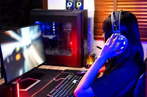 Happy Asia Girl Gamer Wear Headphone Competition Play Video Game Online with Computer Colorful Neon Light in Living Room at Night Stock Image - Image of desktop, competition: 277816529