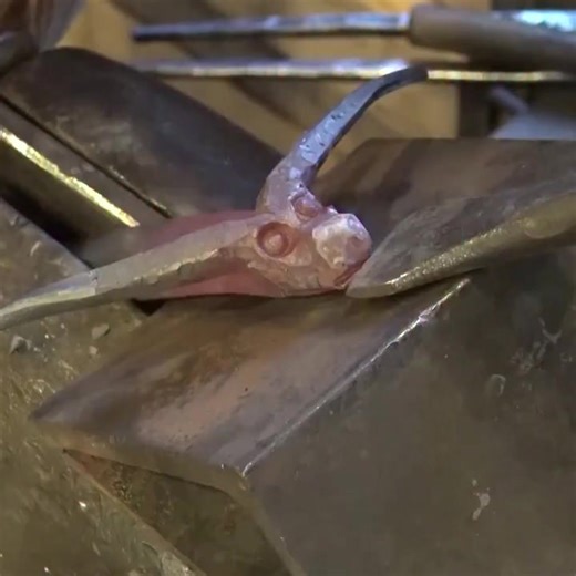 Figure carving: Ram’s head hook