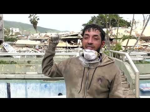 Seeking family, one Venezuelan digs through quake debris by hand