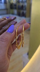 ✨ Ethnic Elegance Gold Plated Large Hoop Earrings with Delicate Hanging Beads | Rs.500 only. ❤ ✨Grace meets glamour with our exquisite gold-plated Dangling hoop earrings. Whether you're dressing up for a special occasion or adding a touch of elegance to your everyday look, these hoops are perfect statement piece. ❤✨ Product Code - ER-454 Price - Rs.500 only. Simply message us to order. Hurry up, only limited stocks are available. 🎁 Special Gift Option: For Nepalis residing outside Nepal, we now