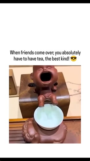 @crazytrend.1 on Instagram: "post showcases a 30-second video of a Chinese tea ceremony using a "pee-pee boy" tea pet—a ceramic infant figurine made from Yixing clay that "pees" hot water into a cup to test brewing temperature, framed as an eccentric yet essential host gift. Rooted in centuries-old gongfu tea practices, these thermochromic toys change color or dispense liquid only with sufficiently hot water (around 90–100°C), blending functionality with folklore where tea pets "absorb" tea esse