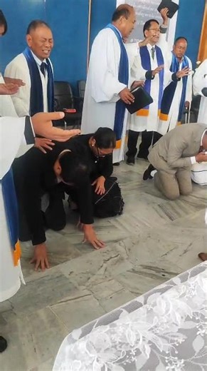 Minister & elders lay down their hands and praying for Reverend Chutilo Apon and Dr Joshua Lorin