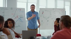 Serious boss speaking to employees in modern office | Free Stock Video Footage