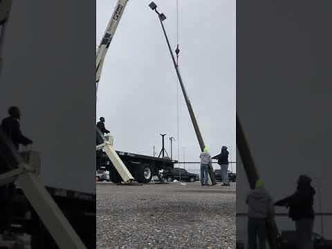 Light pole installation boom truck