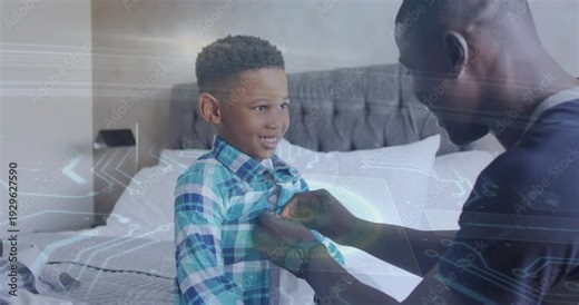 Dad approaching, fastening son's shirt buttons on bed, preparing for school with overlay on buttons