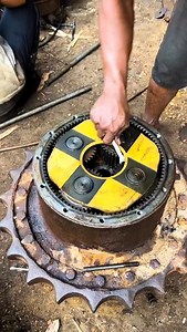 Assembly of a final drive, specifically a planetary final drive, highlighting its complex gearing and the importance of proper lubrication for heavy machinery operation. which is a critical component in heavy machinery like excavators, bulldozers, and other tracked or large wheeled vehicles. Welcome to Congo Trading Parts. Located in the heart of Pointe Noire, we specialize in providing high-quality heavy equipment and machine spare parts. Our commitment to excellence ensures that you find every