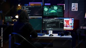 Happy man writing code on PC, celebrating after managing to get past security systems. Hacker using computer to make scripts that can hack devices, feeling proud after breaching firewall, camera B