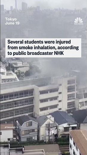 Japanese students on ledge await for rescue from fire
