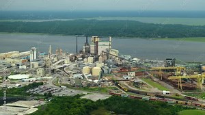 Paper mill factory structure. Brunswick cellulose and paper plant in Georgia, USA. Wood processing factory manufacturing yard