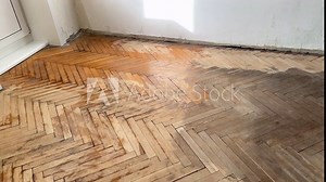 Old parquet background, texture. Old parquet before restoration in an apartment room. Wooden floor background. Old wooden floor in a house.