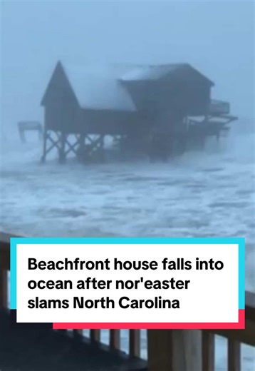 A beach house in North Carolina fell into the Atlantic Ocean on Sunday after a powerful nor'easter slammed the Carolinas and Virginia with near-blizzard conditions, leaving the shoreline in a state of emergency.