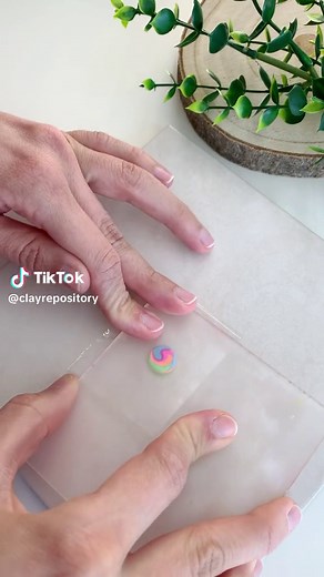 ⭐️ Clay tip: how to embed stud posts. I have shown this process a few times, but always in speedup version, so here’s a slower version so you can see each step. I simply flatten a small ball of clay, pierce it with the stud post and then attach it to the back of the stud earring. I use this wooden pick with the flattened end to make sure the clay is properly combined together and there’s no need for any type of adhesive or liquid clay. This wooden pick you see in the video is part of the Polymer