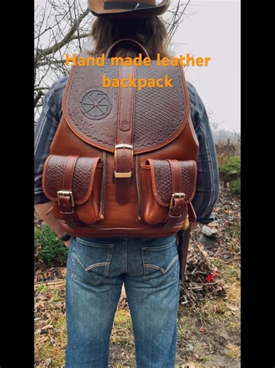 Hand-stitched embossed leather backpack