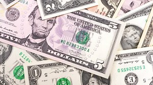 Banknotes in denominations of one to ten USA dollars. Rotation paper money close-up.