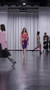 A real eye-catcher on the runway: Our elegant floral dress with the asymmetric cut. 🌺 | Marc Cain