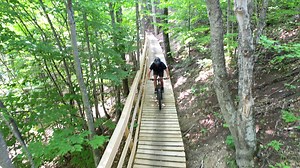 Get outside this fall at The Highlands Bike Park - the ultimate mountain bike destination in beautiful northern Michigan. Book now! 🚵‍♀️🌲 | The Highlands