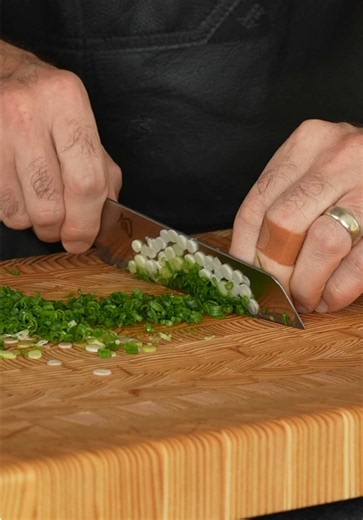 Gracefully, that’s the key. If you want to use your blade to move ingredients around your board, go for it. Don’t use pressure and have a slight angle to your blade. So long as you’re not pushing down hard and you’re just hovering above or hardly touching your cutting board, using your edge to push things around is fine. However, you better at least hone your knives if you do this. If bro says it’s wrecking your edge, bro is just being bro. Don’t listen to bro.