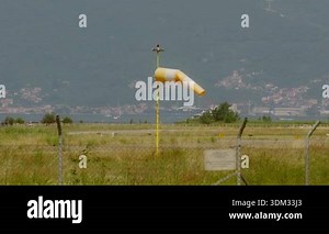Windsocks at airport indicate wind direction as conditions change