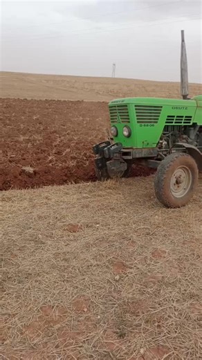 DEUTZ Tractor in Action: Plowing a Barren Field