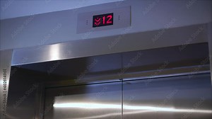 Metal doors smoothly open and close. Silver new elevator on the 1st floor 4k video. Opening the door is an elevator. The elevator doors open.